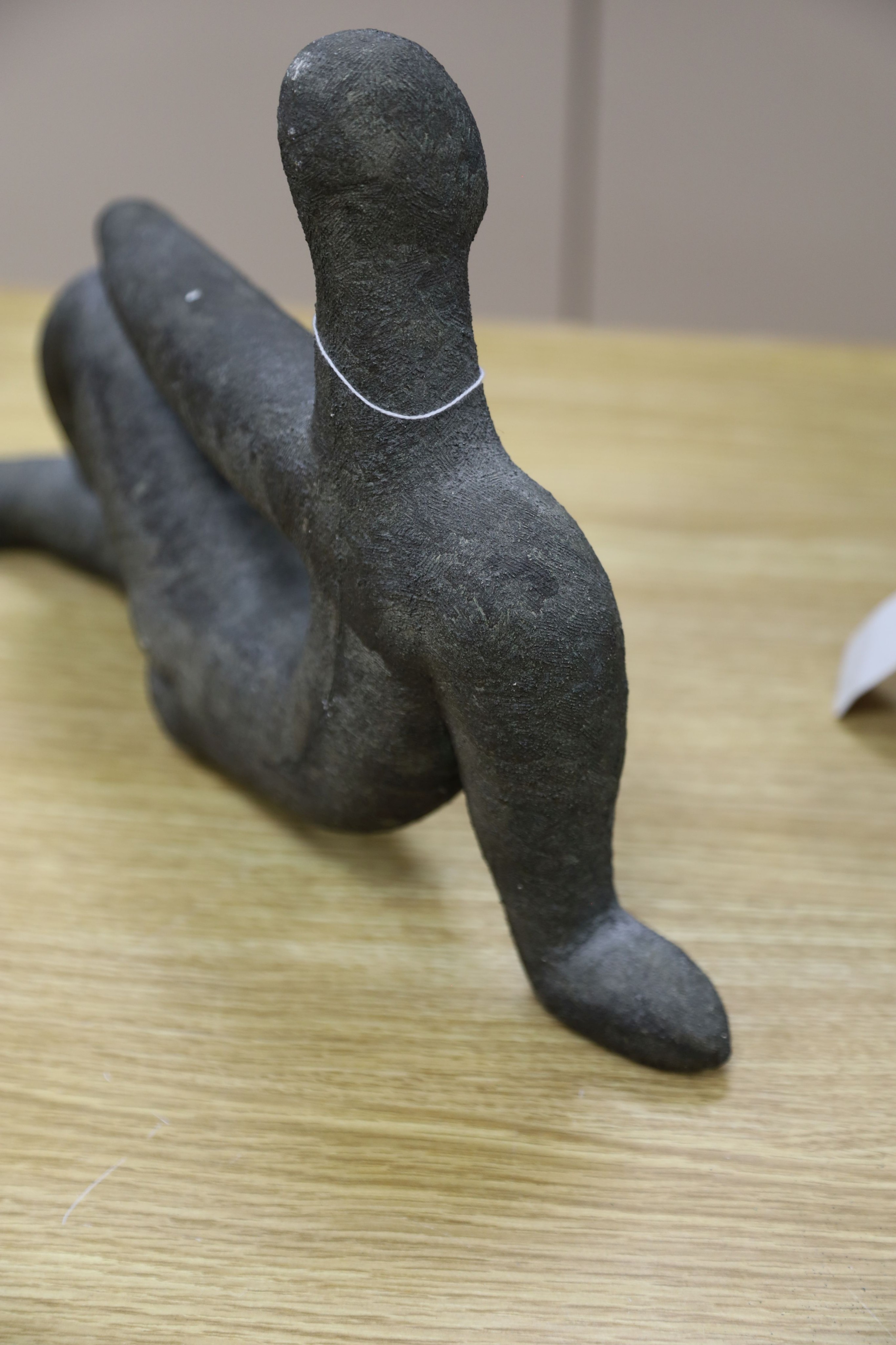 A bronzed pottery abstract figure, marked ‘WP 92’ 40cm